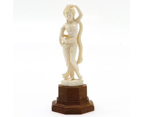carving depicting woman, mounted on wooden basement, 20 cm. tall, this item may not be shipped outside the European Union.