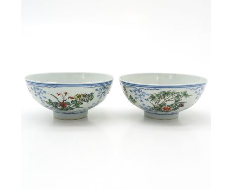 polychrome floral decor, marked on the bottom with 6 characters and double ring, chip and hairline. 