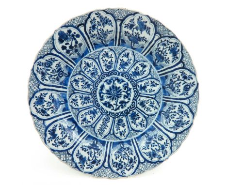 blue and white decor, marked on the bottom with double ring, 38 cm. diameter, chip. 