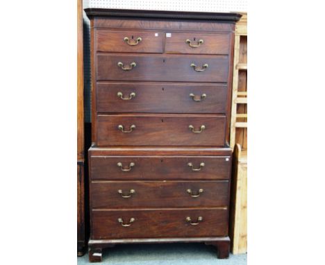 A George III mahogany chest on chest of two short and six long graduated drawers, on bracket feet, 111cm wide x 186cm high. 