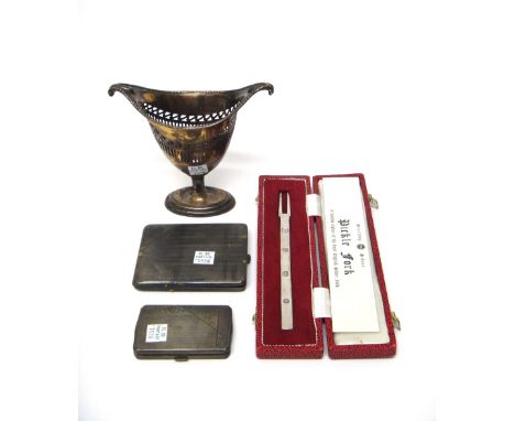 A silver cream pail, of boat shaped form with pierced and engraved decoration in the late 18th century taste and on an oval f