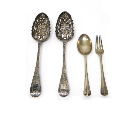 A pair of silver straining serving spoons, with later embossed and pierced decoration, London 1834 and a christening spoon an