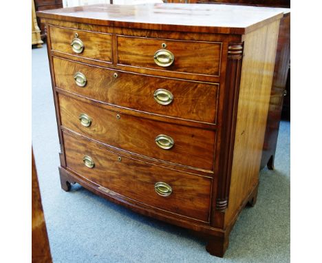 A George IV mahogany bowfront chest of two short and three long graduated drawers, flanked by rounded fluted corners, on brac