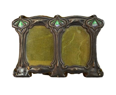 A silver and enamel mounted Art Nouveau twin compartment shaped rectangular photograph frame, the top with two tone green and