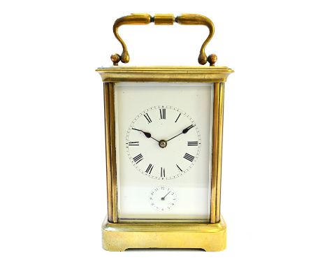 A brass cased carriage clock, late 19th century, the white enamel dial set with a subsidiary alarm, enclosing a two-train mov