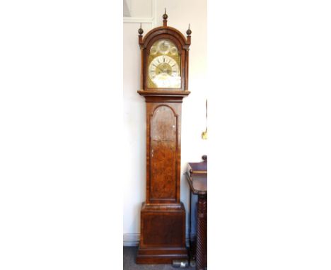A George II eight day walnut and crossbanded longcase clock, the thirteen inch arch top dial with subsidiary day, month,  sec