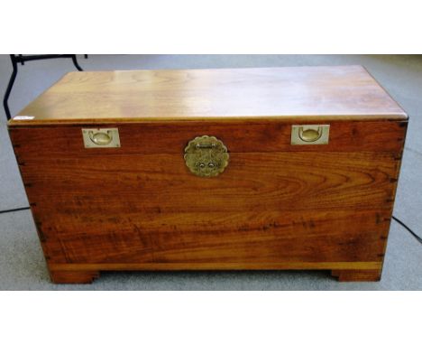 An early 20th century brass mounted rectangular camphorwood trunk on block feet, 102cm wide.