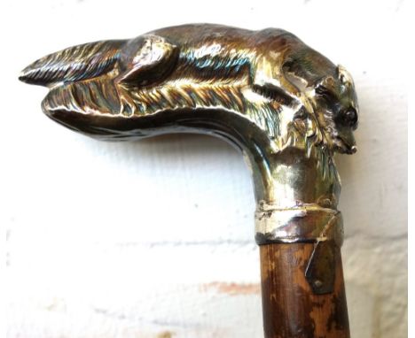 A silver walking stick handle, hallmarked London 1897, cast as a fox and mounted on a later bamboo stick, 84.5cm overall.