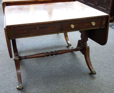 A Regency mahogany sofa table with opposing frieze drawers, on trestle end standards, 91cm wide. 