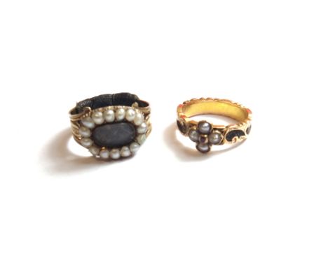 A Victorian gold, half pearl and ruby set mourning ring, the shank mounted with woven hairwork, within scrolled borders, engr
