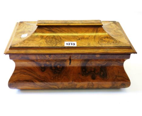 A Victorian figured walnut tea caddy of bloated sarcophagus form with twin lidded interior, 34cm wide. 