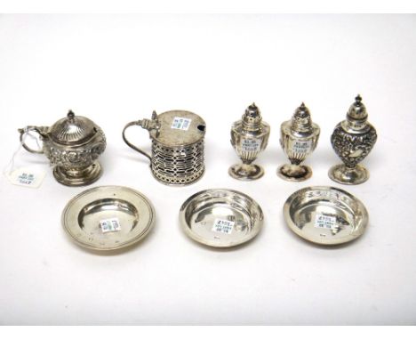 Silver, comprising; a cylindrical mustard pot, having pierced decoration, Chester 1921, a mustard pot, with scroll embossed d