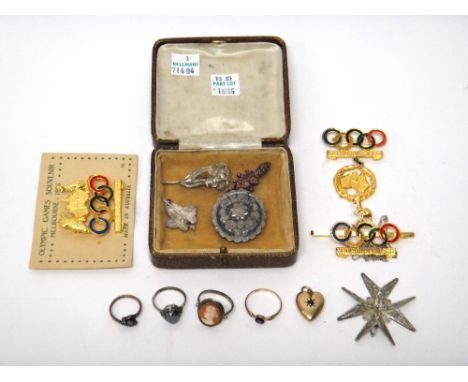 Two gilt metal brooches and one gilt metal tie slide, commemorating The Olympic Games, Melbourne Australia 1956 and jewellery