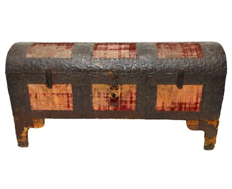 An 18th century red velvet and embossed metal veneered dome top trunk on bracket feet, 127cm x 7cm wide.   Illustrated