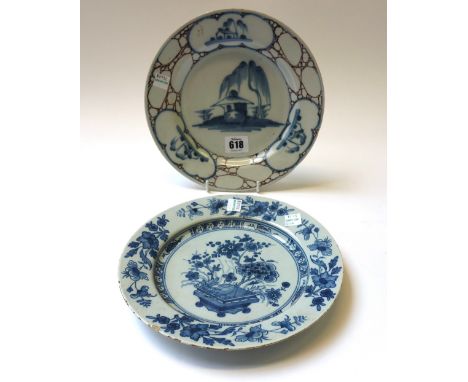 Two English delftware plates, circa 1750, the first, probably Bristol, painted in blue and manganese with a central Chinese h