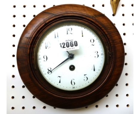 A French walnut cased circular wall clock, late 19th century, with white enamel dial, convex glass and a French single train 
