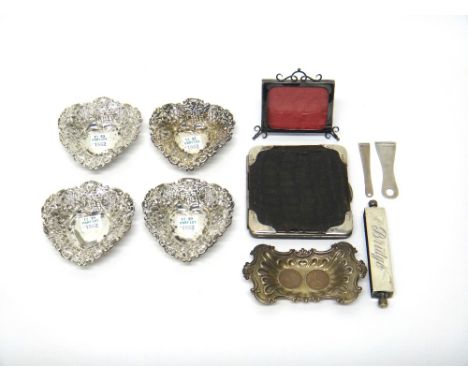 Silver and silver mounted wares, comprising; a set of four heart shaped bonbon dishes, with scroll embossed and pierced decor
