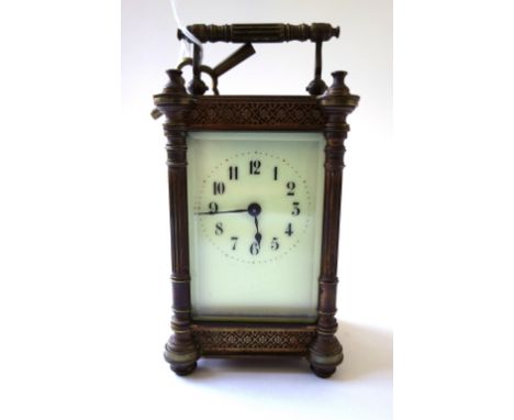 A gilt brass cased carriage clock, late 19th century, the white enamel dial flanked by pillar supports, enclosing a single tr