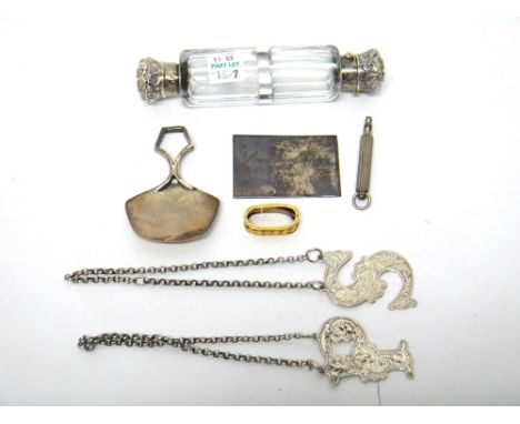 A Victorian silver mounted faceted glass, double ended scent cum smelling salts bottle, a silver tea caddy spoon, Birmingham 