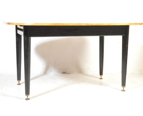 
Ernest Gomme - G-Plan - Librenza - A retro vintage mid 20th Century 1950's English tola wood dining table of circular form. 
