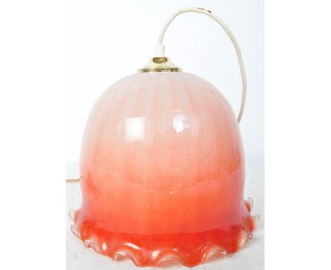 Mid century glass ceiling lampshade - electrolier. The coloured glass shade of fading orange / red with lamp set atop and wit