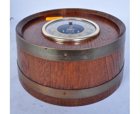 A mid 20th century French Geraud Lafitte barometer within oak brass bound case. With gilt metal case to centre and brass make