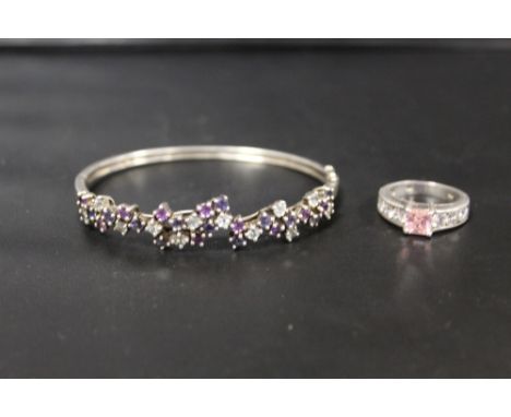 A HALLMARKED SILVER BANGLE TOGETHER WITH A SIMILAR SILVER RING