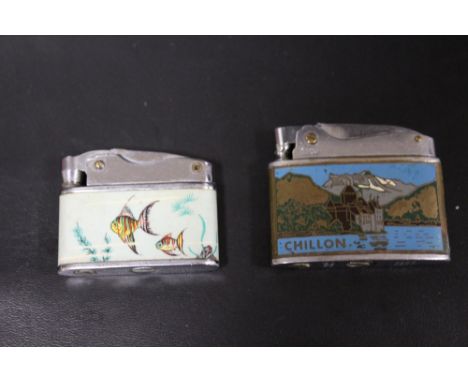 A VINTAGE PENGUIN LIGHTER TOGETHER WITH A SUNFLOWER EXAMPLE