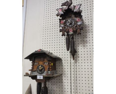 TWO VINTAGE GERMAN CUCKOO CLOCKS - BOTH WITH WEIGHTS AND PENDULUM