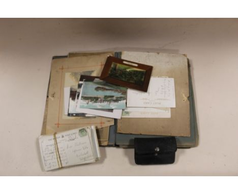 A VINTAGE POSTCARD ALBUM AND CONTENTS TOGETHER WITH LOOSE EXAMPLES AND A PURSE AND CONTENTS