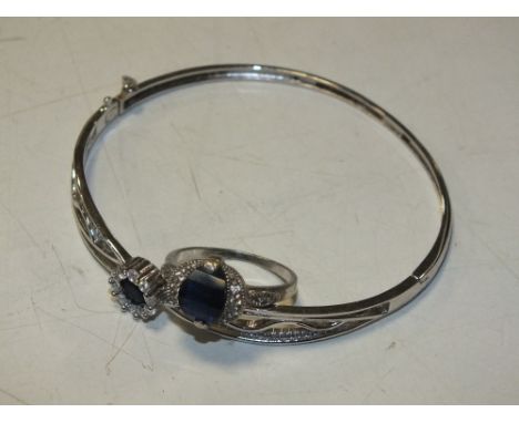 A HALLMARKED SILVER BANGLE TOGETHER WITH A SIMILAR SILVER RING