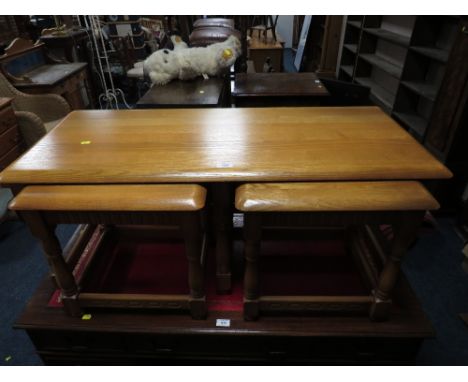 A LIGHT OAK NEST OF ERCOL STYLE TABLES (3)