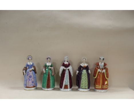 FIVE CERAMIC FIGURES OF THE WIVES OF KING HENRY VIII, COMPRISING ANNE BOLEYN, ANN OF CLEVES, CATHERINE OF ARAGON, CATHERINE H