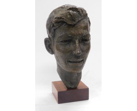 A 20thC hollow cast bronze bust of a gentleman, raised on a wooden base, 35cm high.