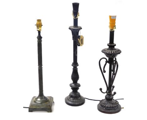 A Minster black column form table lamp, 62cm high, column table lamp, 44cm high, and a further table lamp, 57cm high. (3)&nbs