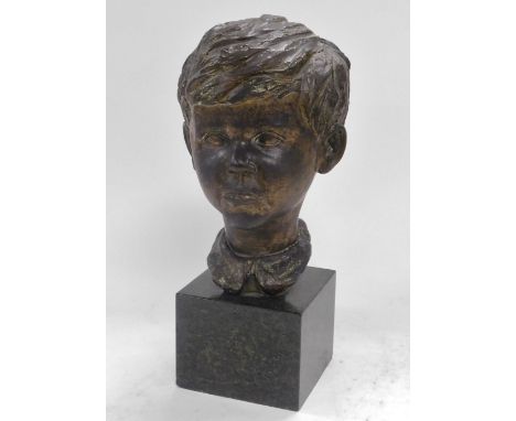 A 20thC bronze bust of a boy, signed indistinctly, raised on a cube form green marble base, 41cm high.