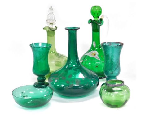 A group of late 19thC green glass, including a Mary Gregory type decanter and stopper, claret jug and stopper, enamel decorat