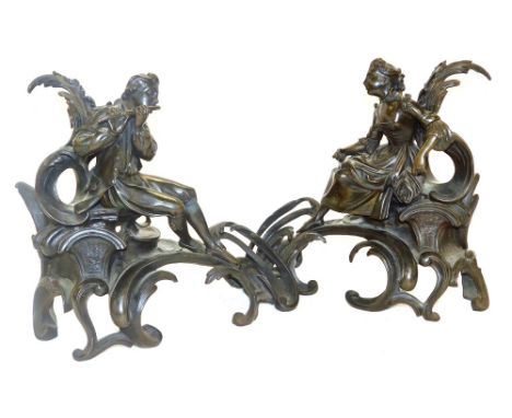 A pair of late 19thC French bronze chenets, of eighteenth century form, cast with a seated lady, and a gallant playing a flut