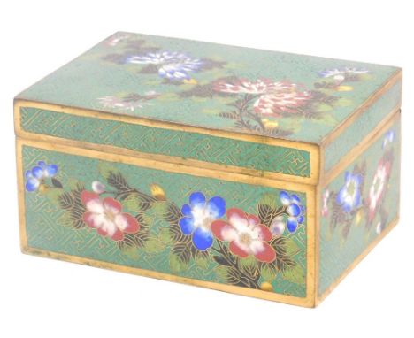 A Chinese cloisonne enamel cigarette box, decorated with chrysanthemums and other flowers, stamped to base China, 12cm wide. 
