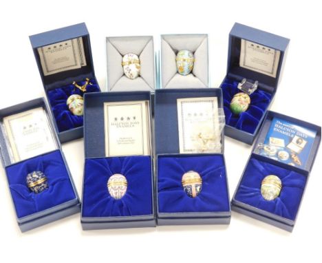 Eight Halcyon Days enamel egg shaped trinket boxes, varying designs, to include frogs, cockerels, snails, each 3cm high, boxe