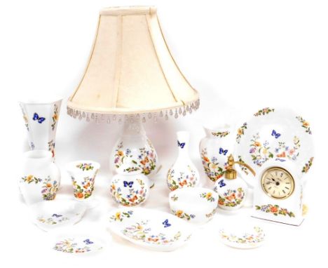 A group of Aynsley Cottage Garden porcelain, including table lamps, mantel clock, atomizer, vases, bowls and dishes. (a quant