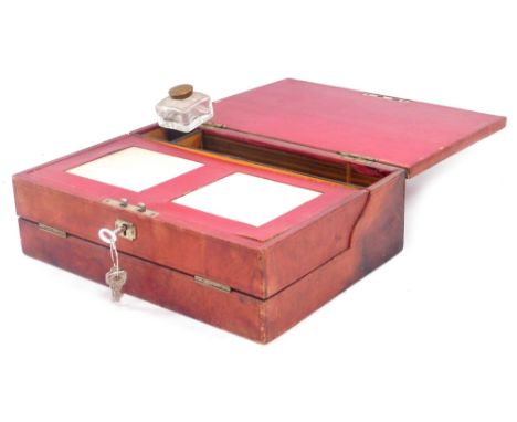 A Victorian red Morocco leather bound writing slope, with a recessed handle to the lid, gilt stamped D.N. from E.S, opening t