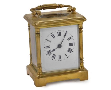 A 20thC French brass carriage clock, rectangular enamel dial bearing Roman numerals, single barrel movement, the case of conv