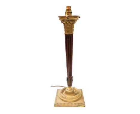 A brass and mahogany Corinthian column table lamp, with a fluted column raised on a square base, 58cm high.&nbsp;Buyer Note: 