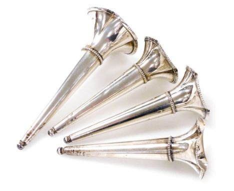 Four Victorian silver epergne holders, each of fluted trumpet form, 1.82oz, 13cm high (1), and 11cm high (3).