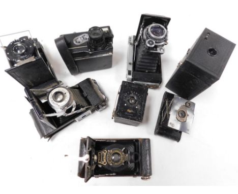 A group of cameras, including a Omockba-5 camera, Kodak cameras, Houghton-Butcher, and a Ditmar cine camera. (8)