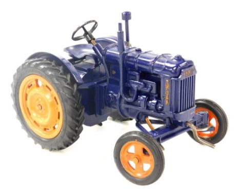 A Chad Valley Fordson Major model of a tractor, with a blue chassis, 16cm wide. 