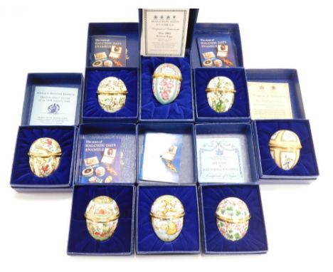 Eight Halcyon Days enamel egg shaped trinket boxes, differing designs, to include flowers, teddy bears, birds, etc, each 6cm 
