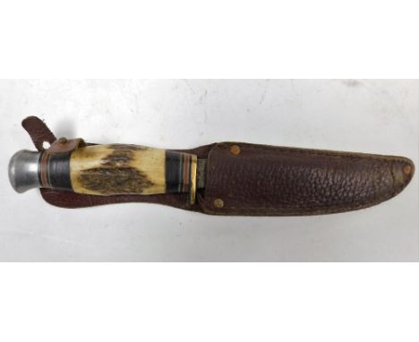 A William Rogers steel and bone handled hunting knife, leather sheathed, 23cm wide.