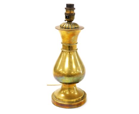 A brass baluster shaped vase, converted to a table lamp, 32cm high.